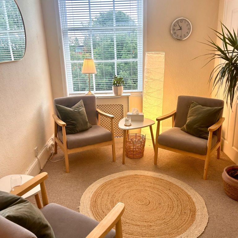 Cosy, welcoming therapy room with comfortable chairs for counselling